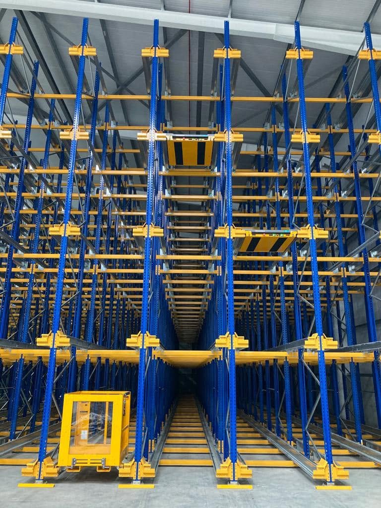 High-density blue and yellow pallet racking installation